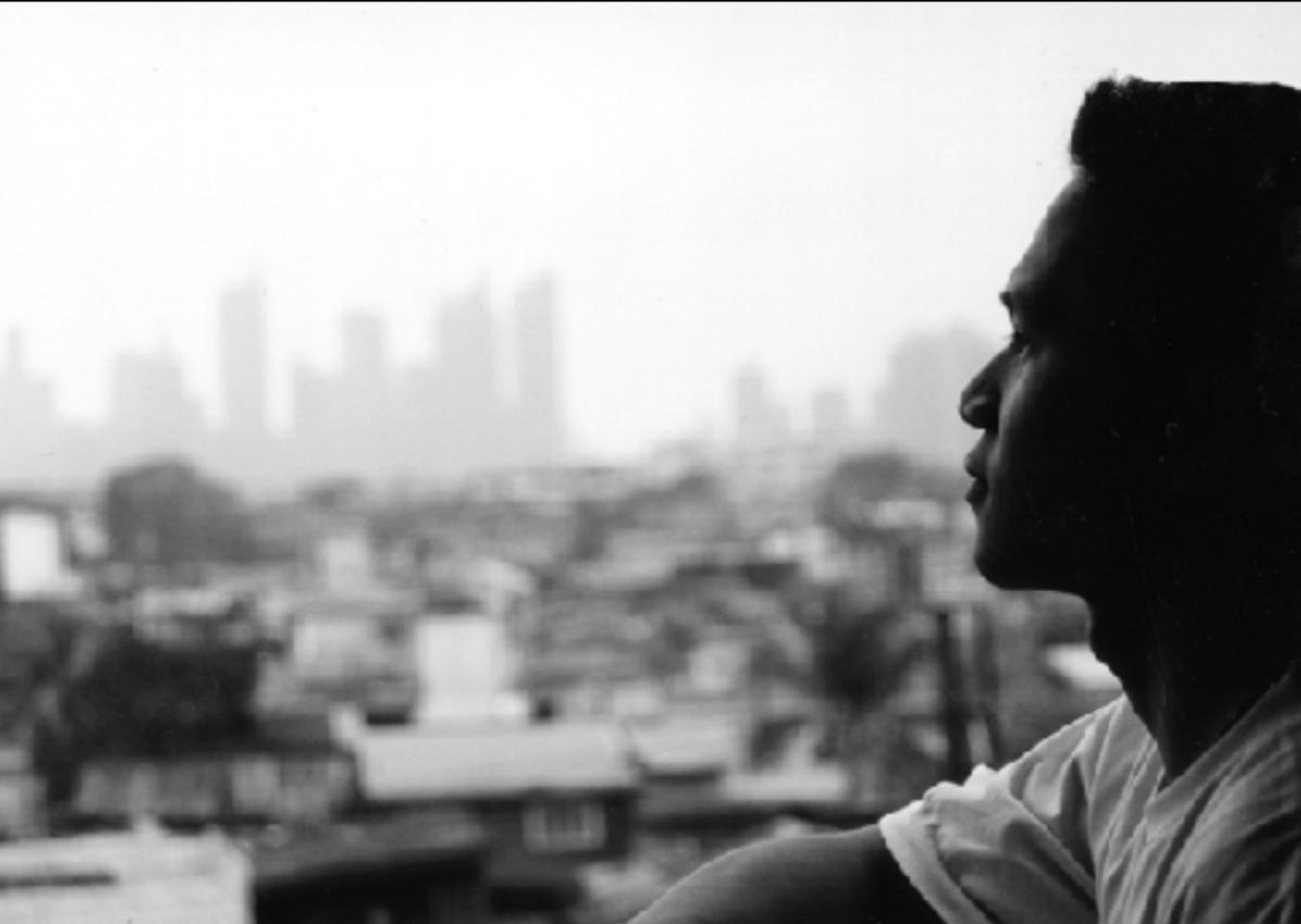 Young man gazing at his hometown of Manila, Philippines
