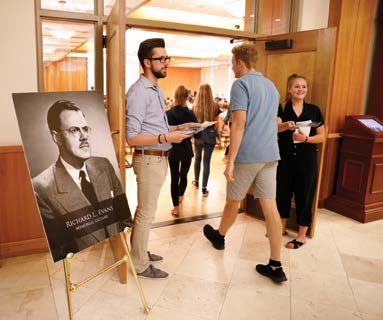 Student Interfaith Club leaders (Nick Hainsworth and Lauren Cranor) greeting audience members for Richard Mouw’s Richard L. Evans Memorial Lecture 2019. Photo by Andrew C. Reed.