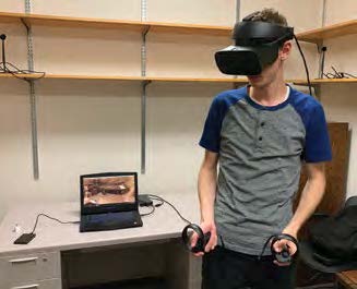 a guy with virtual reality setup