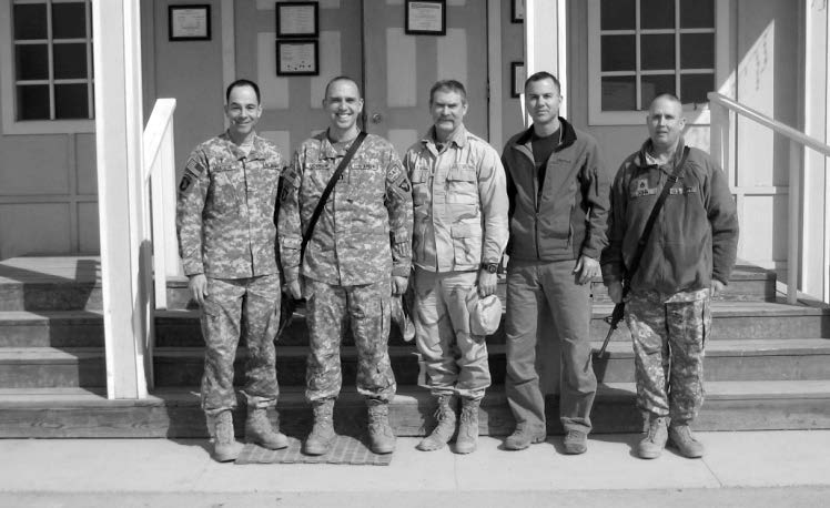 Leadership of the Bagram Military Branch in front of the Enduring Freedom Chapel at Bagram Airfield in Afghanistan. Left to right: Chaplain James Montoya, Geoffrey Anderson (branch president), James Maxwell (first counselor), Kenneth Porter (second counselor), and Steven Dunn (district council member). Courtesy of Eugene J. Wikle.