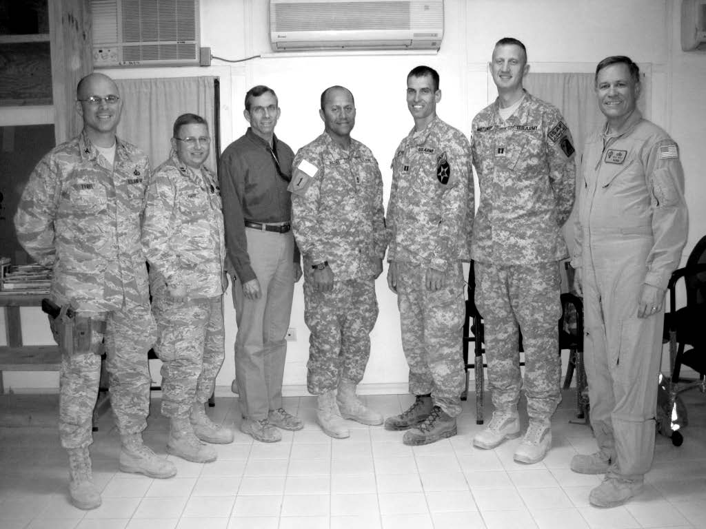 Kabul Afghanistan Military District leadership. Left to right: Todd Tyree, district council (Colonel, U.S. Air Force); Erik Harp, district council, Latter-day Saint chaplain (Captain, U.S. Air Force); John Pearson, branch clerk (U.S./NATO civilian staff); Joseph Jacobs, second counselor; Brent Bethers, Kabul Branch president; Justin Metcalf, first counselor; and Eugene J. Wikle, district president. Courtesy of Eugene J. Wikle.