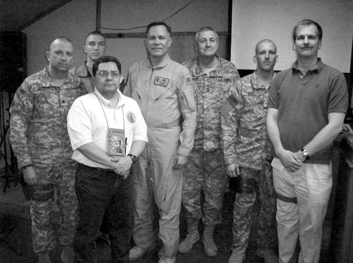 This photo of the Camp Phoenix service member group, which met in Kabul, was taken on February 22, 2009. Left to right: Alan Johnson, John Griffin, Frank Gomez (group leader), Gene Wikle (district president), Gerald Baumann, Clifford Teel, and Timothy Hall. Courtesy of Eugene J. Wikle.