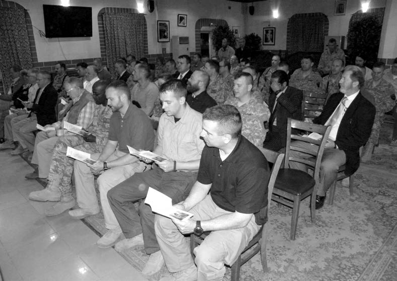 Attendees at a fireside presentation by Elder Bruce A. Carlson, General Authority Seventy, at ISAF headquarters on March 15, 2011, in Kabul, Afghanistan. Courtesy of Eugene J. Wikle.