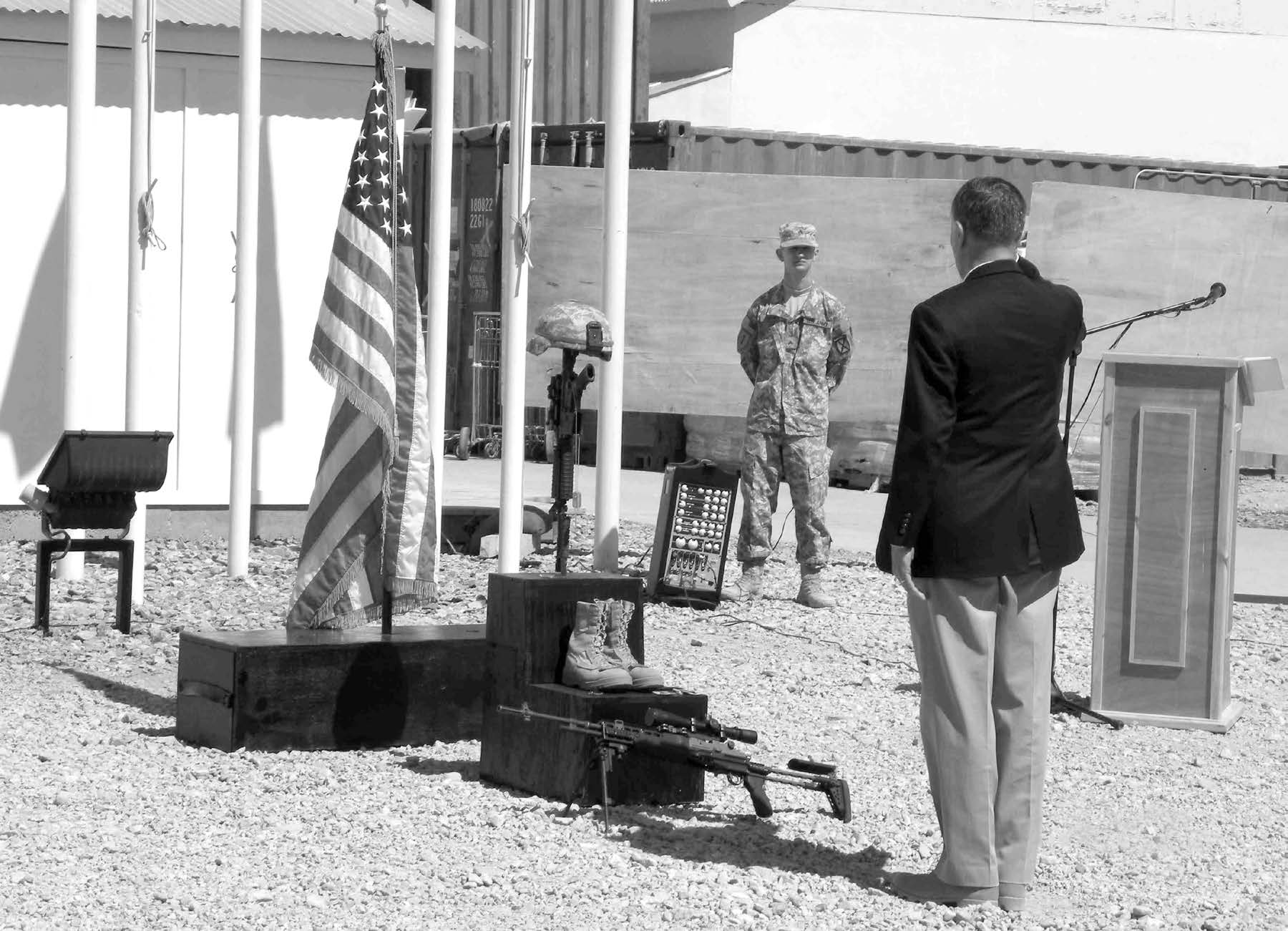 President Gene Wikle renders a final salute after a memorial service for Sergeant First Class Glen J. Whetten at Camp Blackhorse, east of Kabul. U.S. soldiers, sailors, Marines, and airman along with coalition forces from Afghanistan, Australia, Canada, France, and Germany paid tribute to Brother Whetton. Courtesy of Eugene J. Wikle.