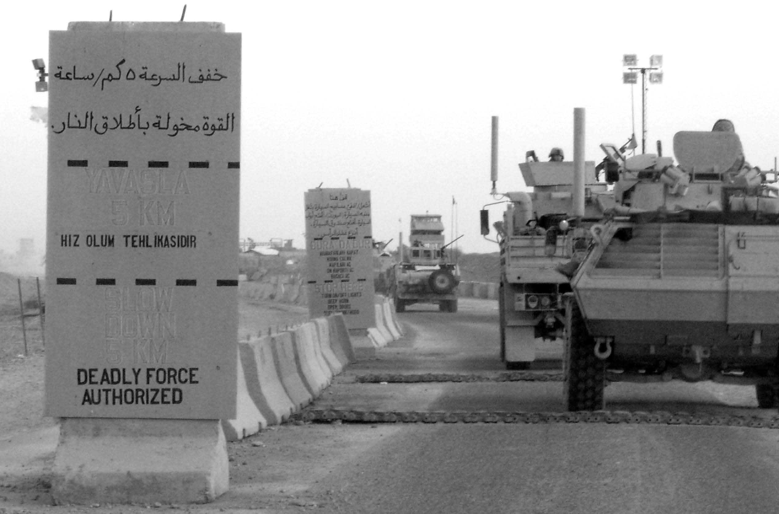 A U.S. military convoy entering Forward Operating Base Q-West after completing a mission in May 2008. Courtesy of Bernt Jenkins.