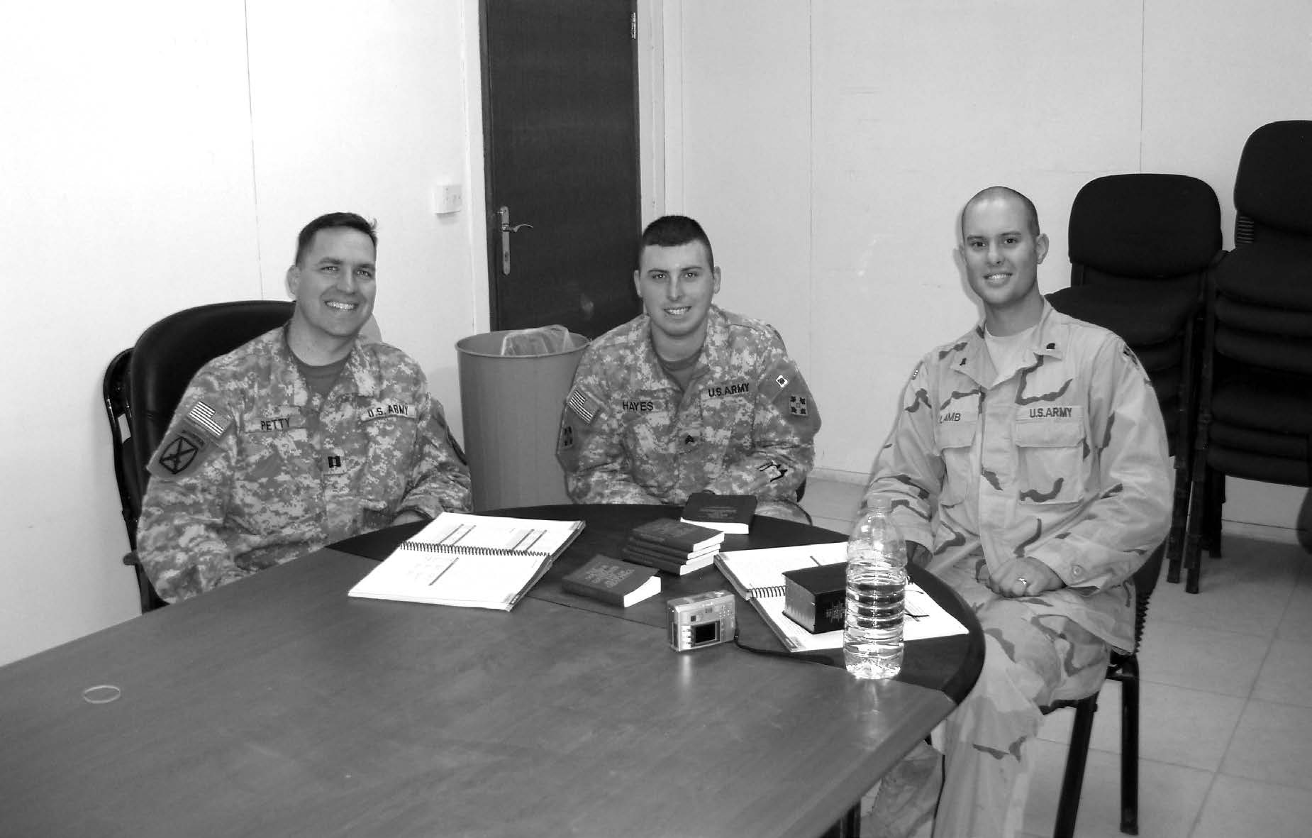 Jon Petty, Johnathan Hayes, and Ty Lamb share a missionary discussion in preparation for baptism in the Engineer Chapel at Camp Liberty, Baghdad, on July 6, 2006. Courtesy of Jon Petty.