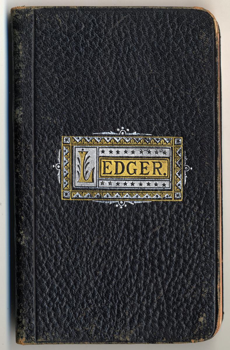 Adolf Haag’s second mission journal, with a brown leather cover and the title “Ledger.” The pages are ruled with horizontal lines in black and with some vertical lines in red.