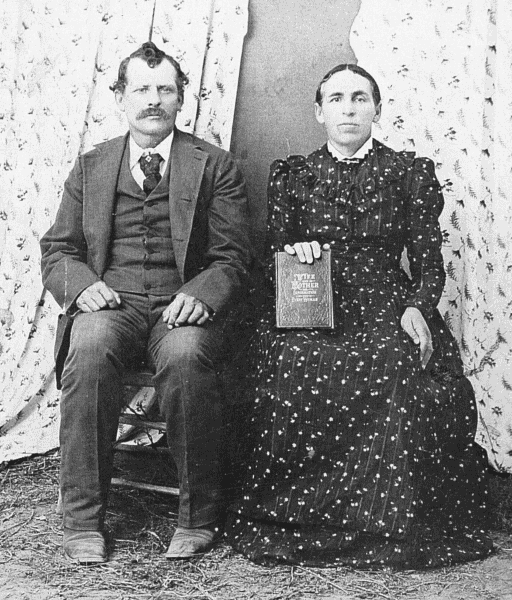 Alvin Bradford and Sarah Jane Curtis Kempton; Sarah holding a book.