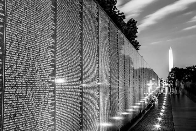 The Vietnam Veterans Memorial at night.