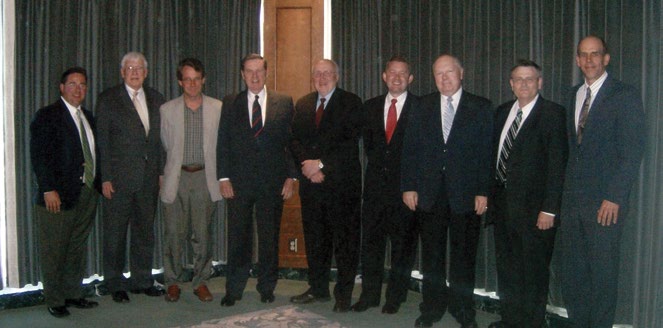 Gathered in Salt Lake City are Gregory Johnson, Elder Robert Wood, Gerald McDermott, Elder Jeffrey Holland, Richard Mouw, Spencer Fluhman, Robert Millet, Grant Wacker, and Grant Underwood.