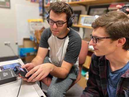 BYU student sound engineers Mitchell Bashford and Connor Miller work on sound leveling for a Y Religion episode.