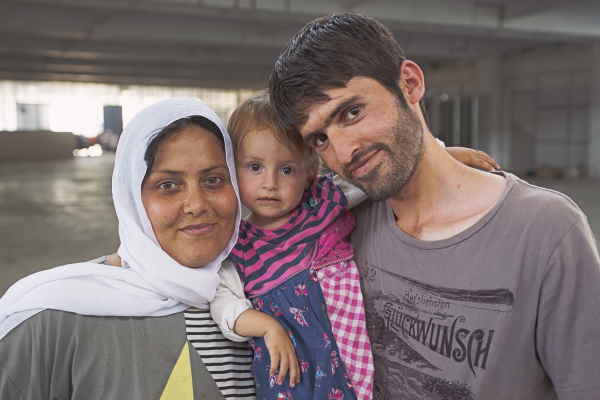 photo of faroosh with his wife and daughter