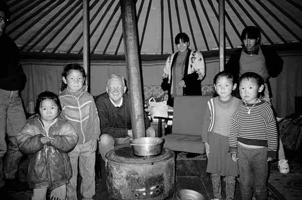 photo of president cook with children in a ger