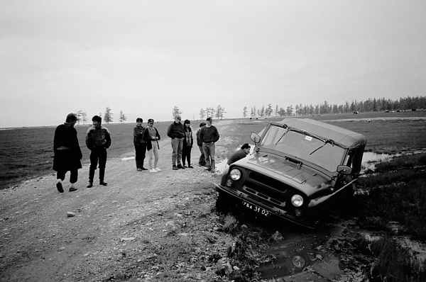 photo of the cooks' jeep stuck in the mud