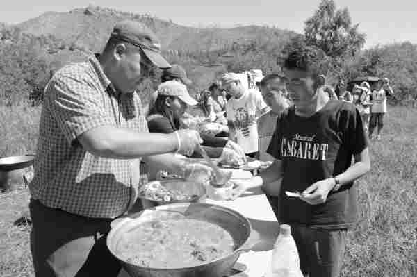 photo of enkhbat damdin cooking at a ysa conference
