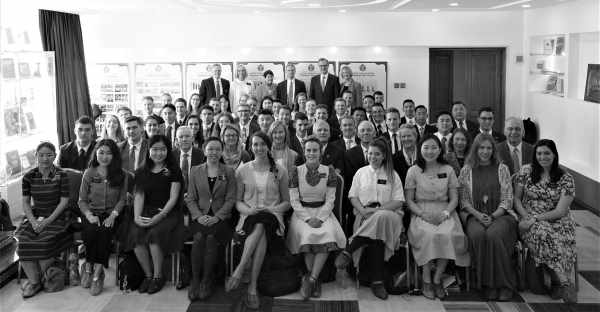 photo of the bednars with missionaries at a mission conference