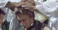 Three angels place their hands upon Joseph Smith's head